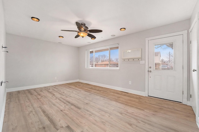 entrance foyer with ceiling fan and light wood-type flooring