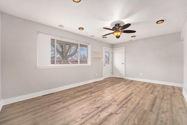 spare room with ceiling fan and hardwood / wood-style floors