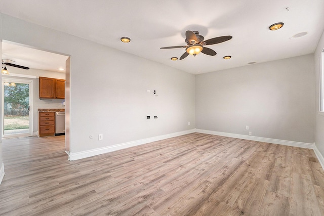 empty room with light hardwood / wood-style flooring