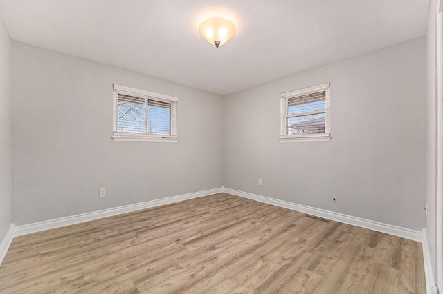 unfurnished room featuring light hardwood / wood-style floors