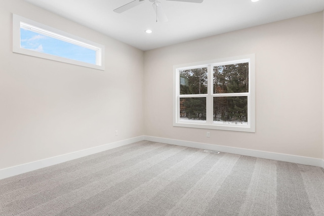 carpeted empty room with ceiling fan