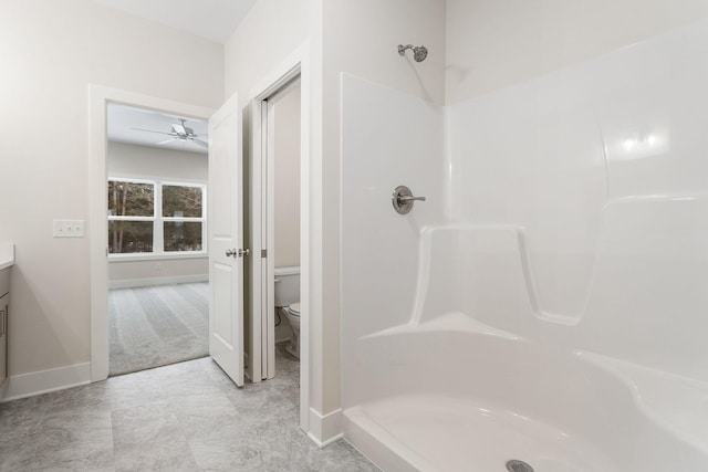 bathroom with vanity, toilet, walk in shower, and ceiling fan