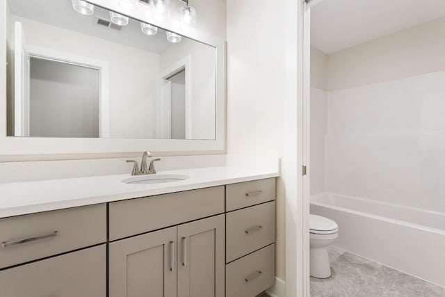 full bathroom with vanity, shower / bath combination, and toilet