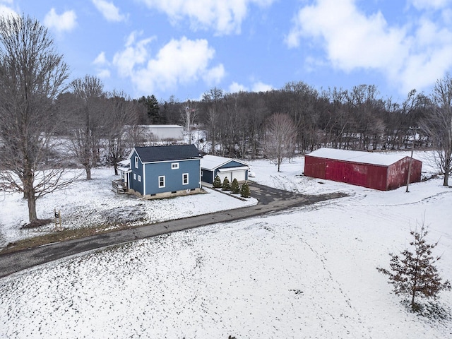 snowy yard with an outdoor structure