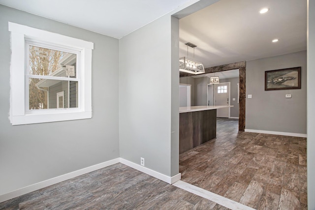 unfurnished room featuring dark wood-type flooring