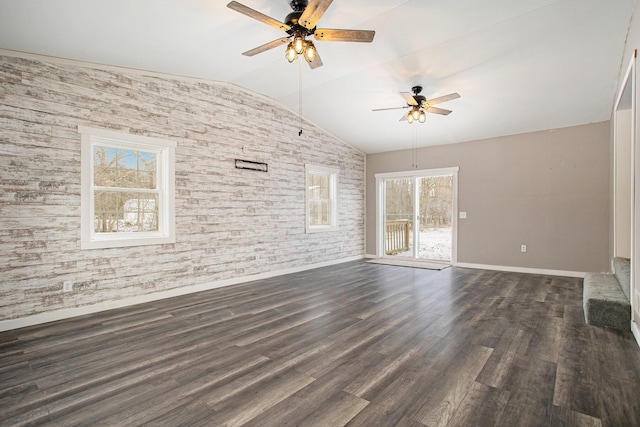 interior space with dark hardwood / wood-style floors, ceiling fan, and lofted ceiling