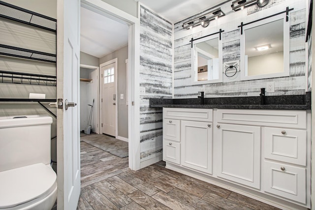 bathroom featuring vanity and toilet