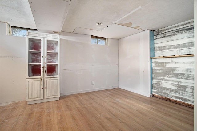 basement featuring light hardwood / wood-style flooring