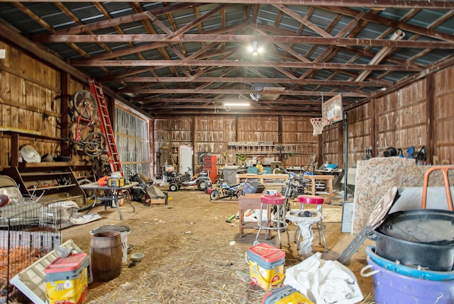 misc room with a workshop area and lofted ceiling