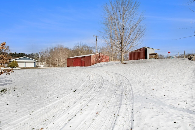 yard covered in snow with an outdoor structure