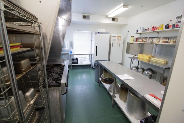 kitchen featuring white fridge