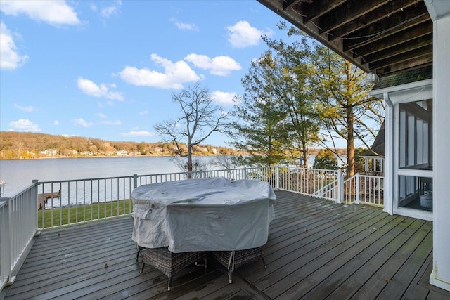 wooden deck featuring a water view