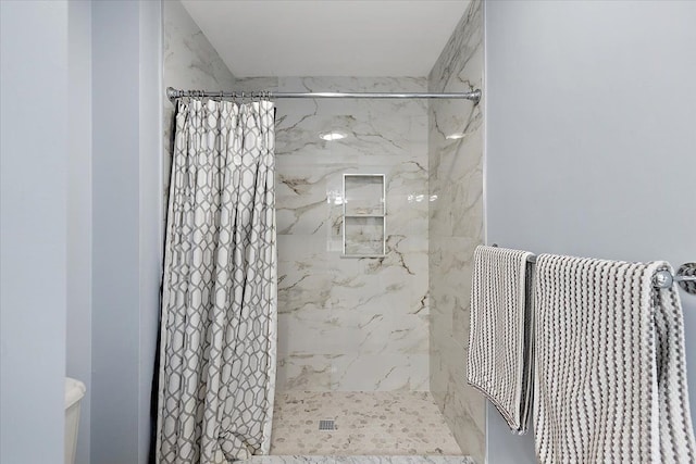 bathroom with a shower with shower curtain