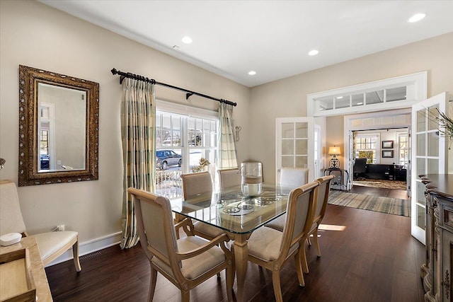 dining space featuring french doors and dark hardwood / wood-style floors