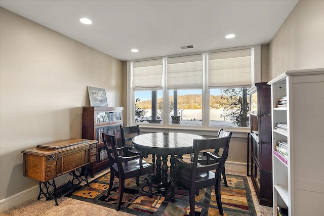 view of carpeted dining space