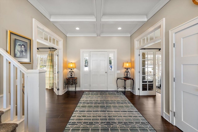 foyer entrance featuring beamed ceiling, ornamental molding, dark hardwood / wood-style flooring, and coffered ceiling