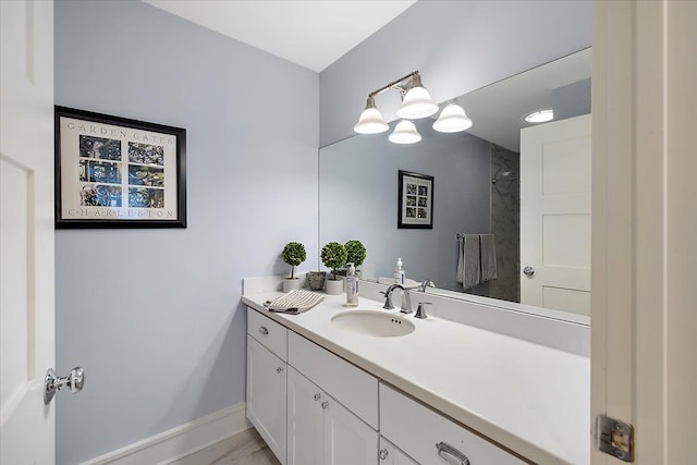 bathroom with tile patterned floors and vanity