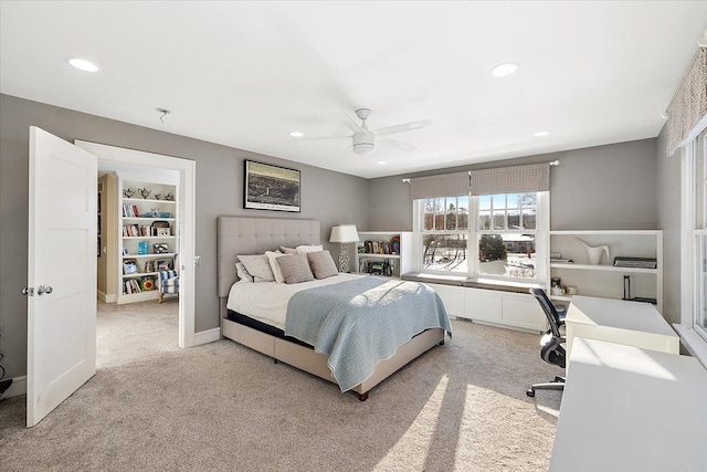 bedroom featuring light carpet and ceiling fan