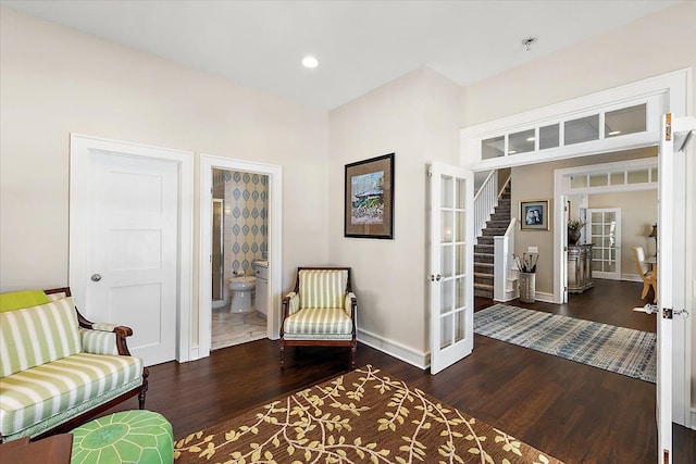 sitting room with french doors and dark hardwood / wood-style floors