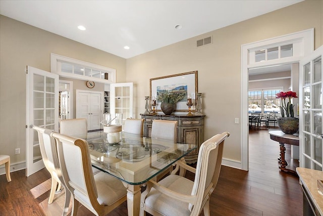 dining area featuring dark hardwood / wood-style floors and french doors