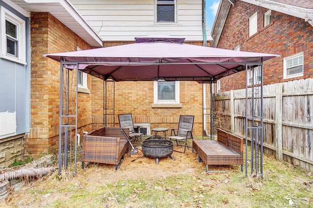 view of patio / terrace with a gazebo and an outdoor fire pit