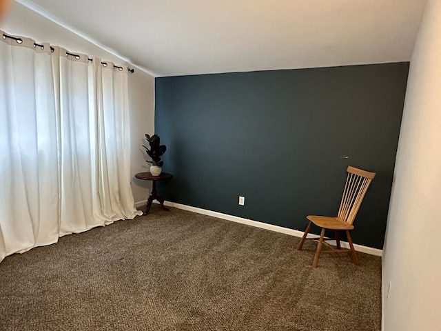 unfurnished room with dark carpet