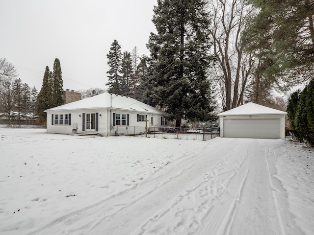 ranch-style home with an outbuilding and a garage