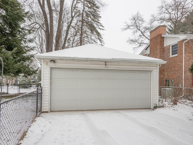 view of snow covered garage