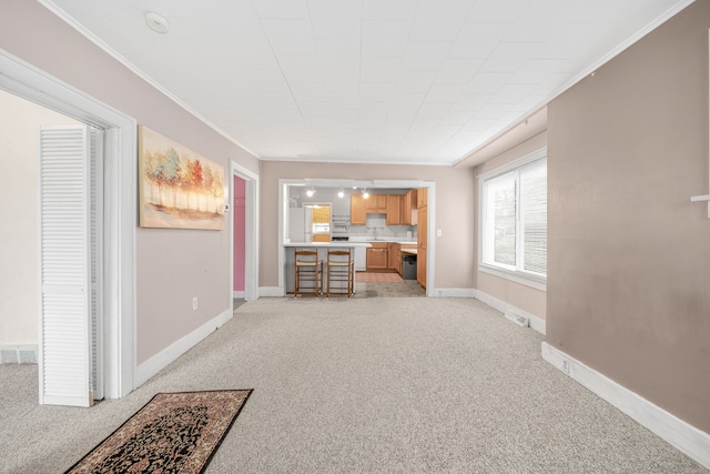 living room with ornamental molding and light colored carpet