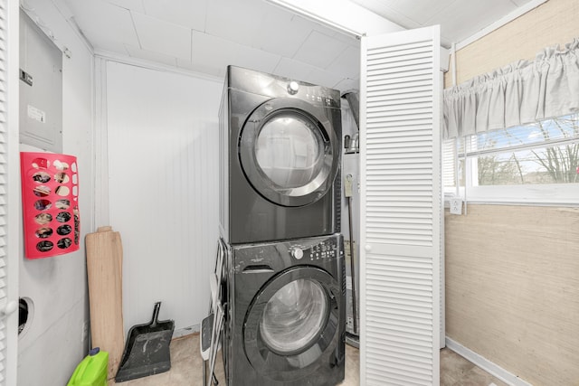 laundry room featuring stacked washer and dryer