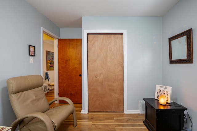 sitting room with light hardwood / wood-style floors