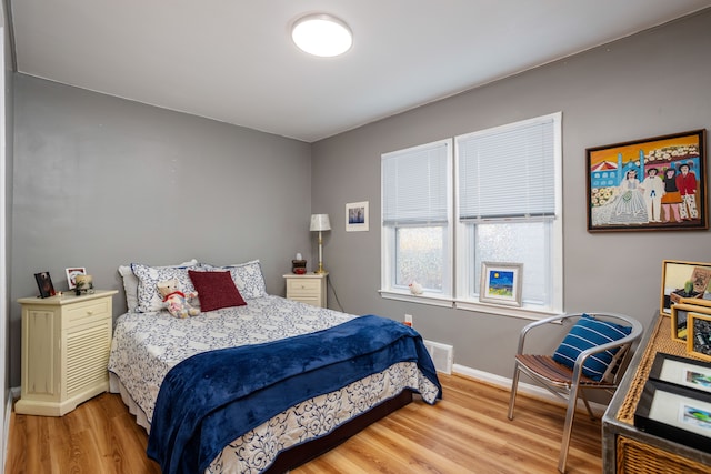 bedroom with wood-type flooring