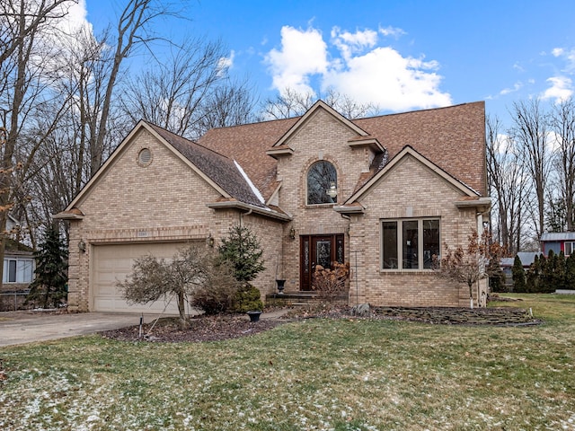 view of front of property featuring a garage and a front yard