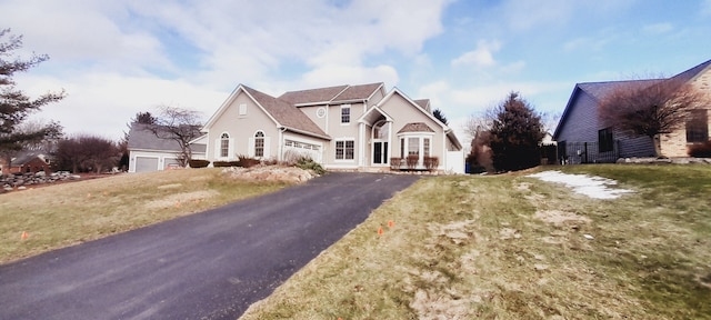 view of front of house with a garage, driveway, and stucco siding