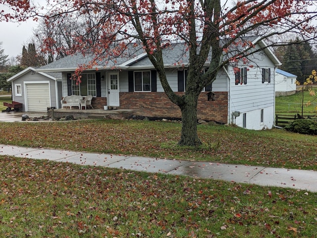 view of front of home with a front yard and covered porch