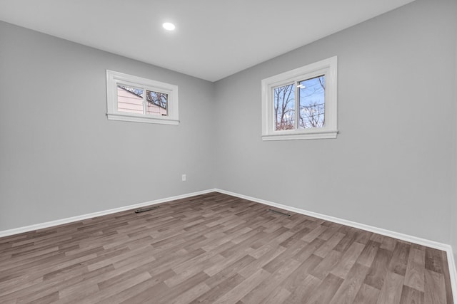 unfurnished room featuring light hardwood / wood-style flooring