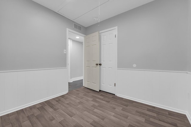 spare room with hardwood / wood-style flooring