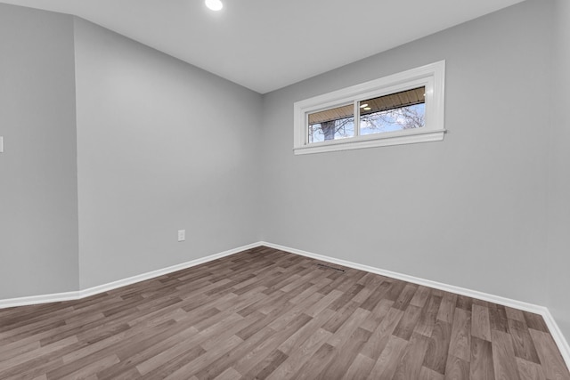 spare room with light wood-type flooring