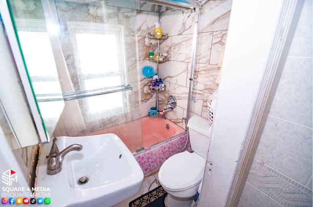 full bathroom featuring toilet, shower / bathtub combination, and sink