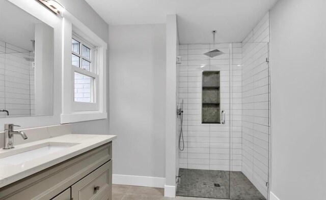 bathroom with vanity, tile patterned floors, and an enclosed shower