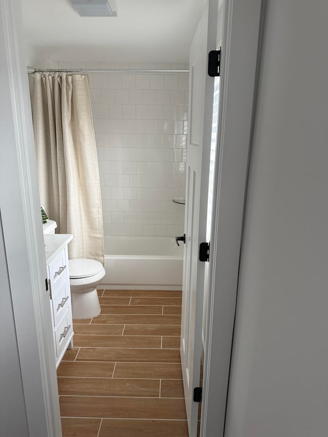 full bathroom with vanity, toilet, and shower / bath combo with shower curtain