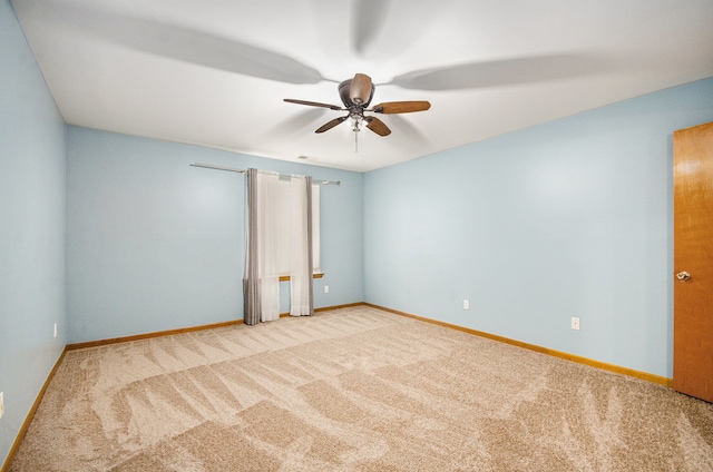 unfurnished room featuring carpet and ceiling fan