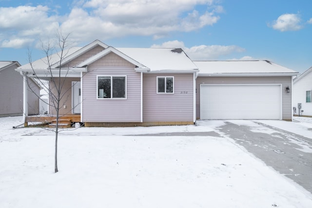 ranch-style house featuring covered porch and a garage