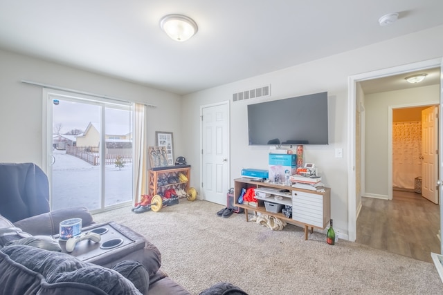 rec room featuring visible vents, baseboards, and carpet floors