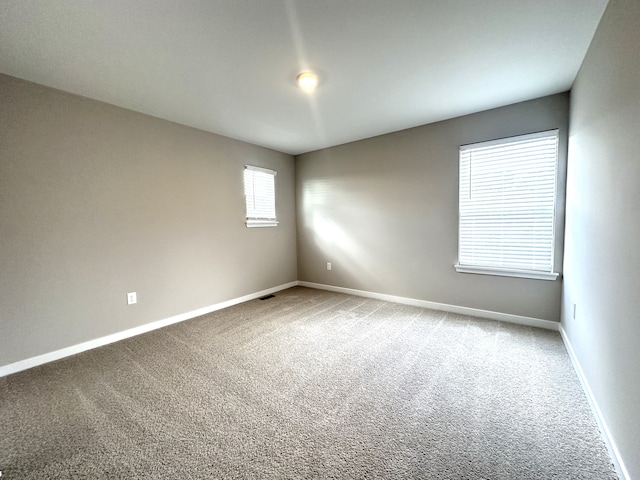 empty room featuring carpet flooring