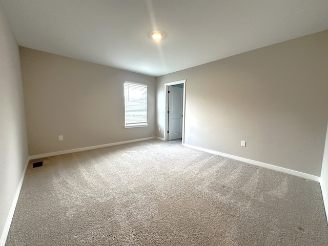 empty room featuring carpet floors