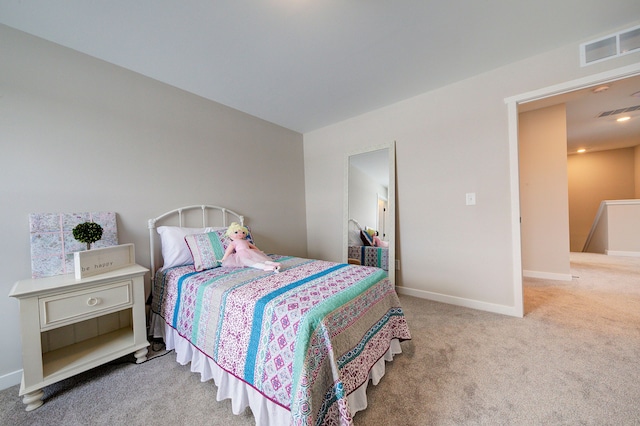 bedroom with light colored carpet