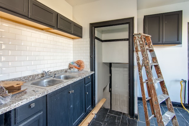 kitchen with backsplash and sink