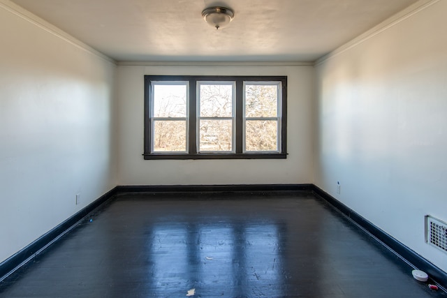 unfurnished room featuring crown molding