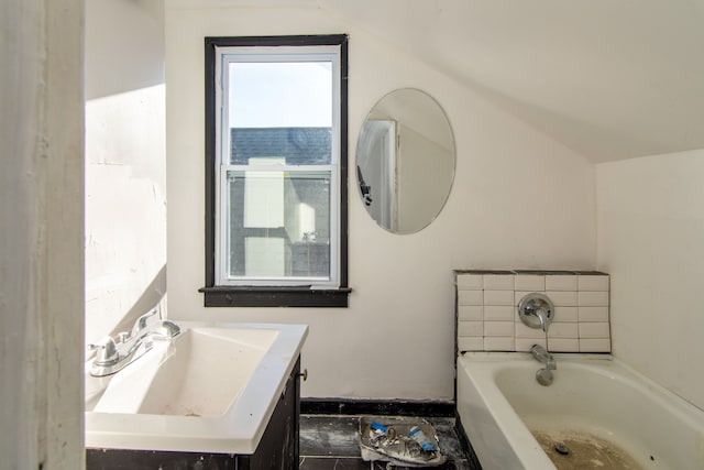 bathroom featuring vanity and a bath